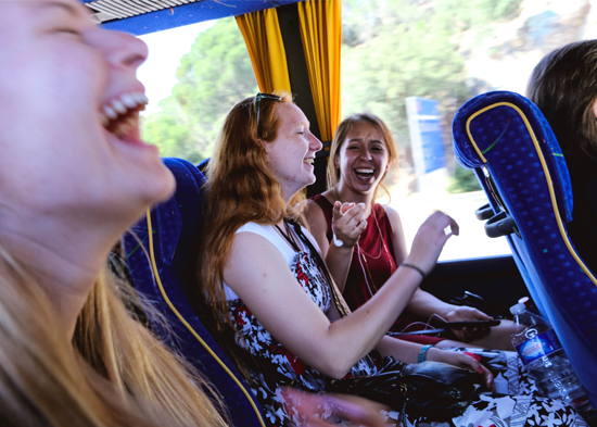 Happy girls on a bus