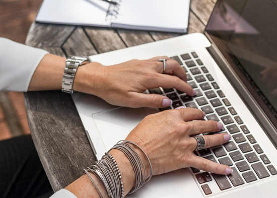 Woman typing on computer