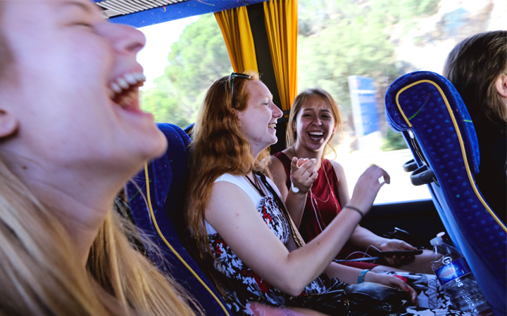 Happy girls on a bus