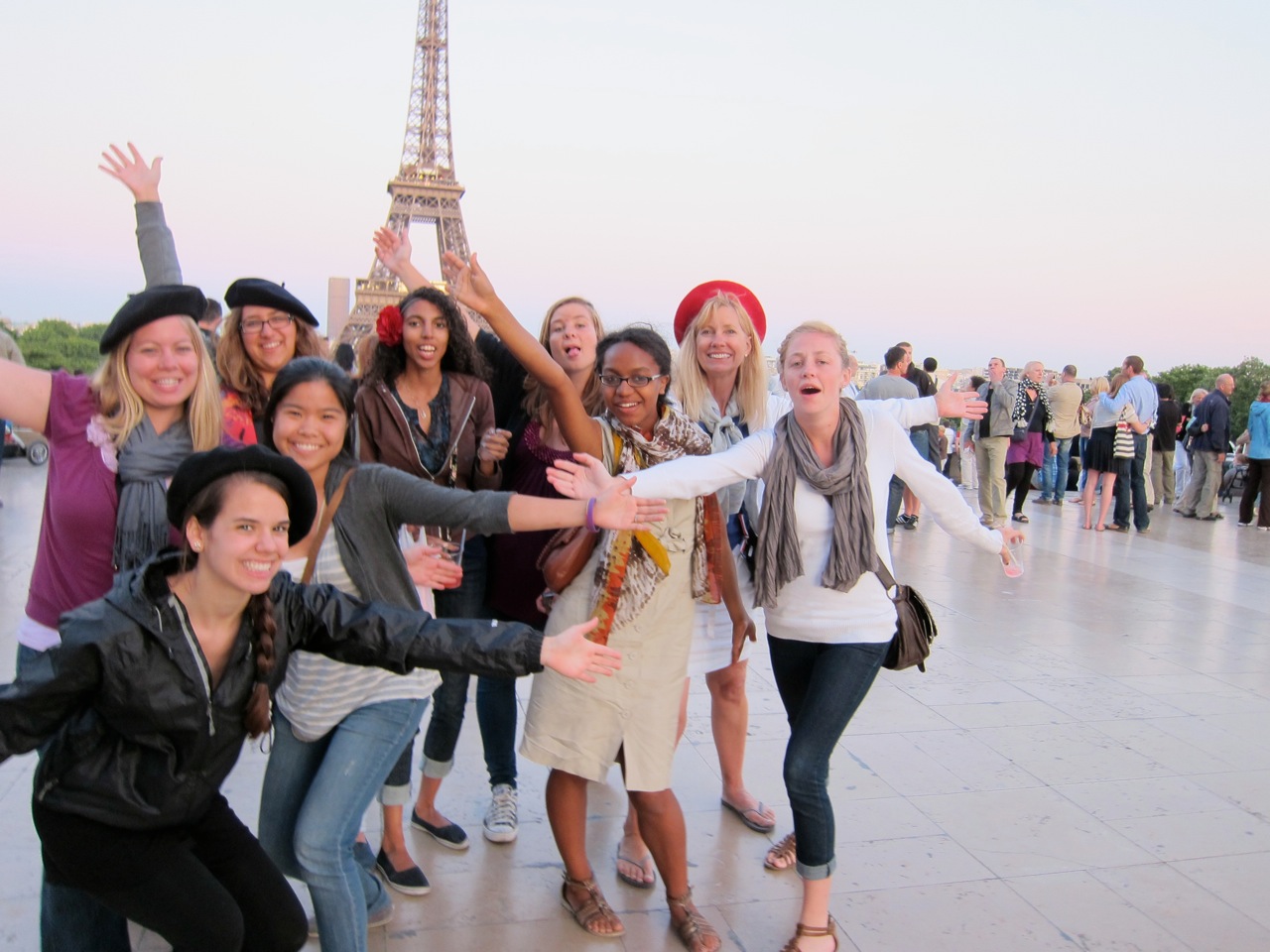 Happy group with Eiffel Tower distant