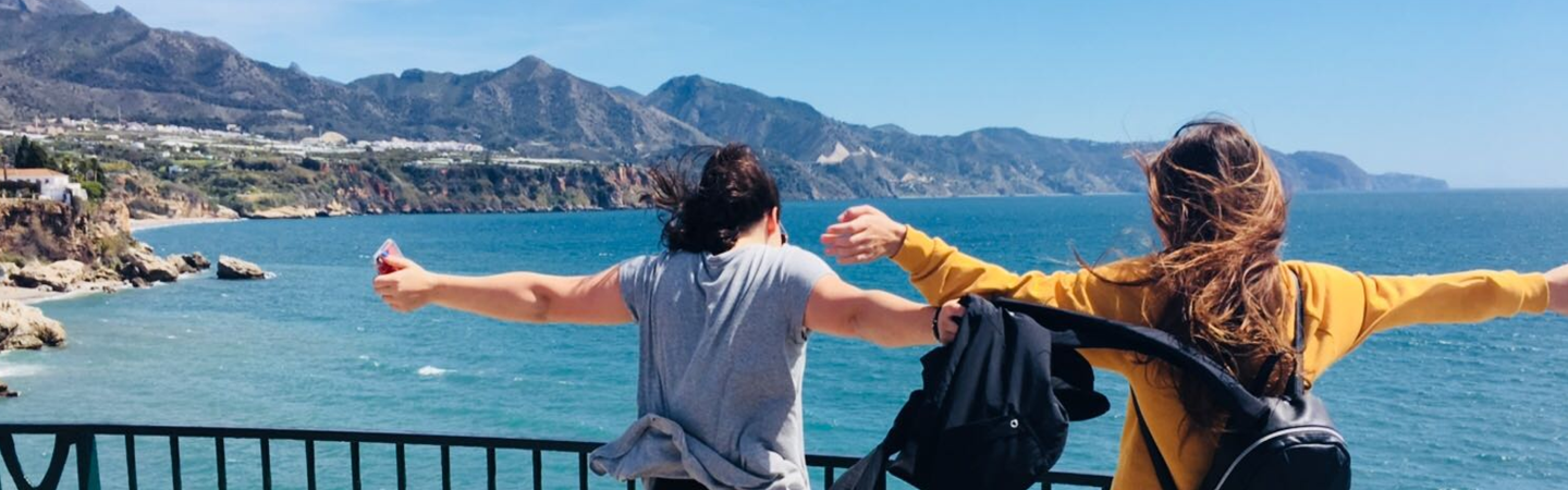 Two girls overlooking the sea