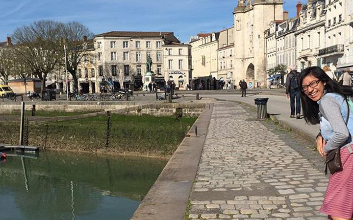 Girl walking along the Seine 