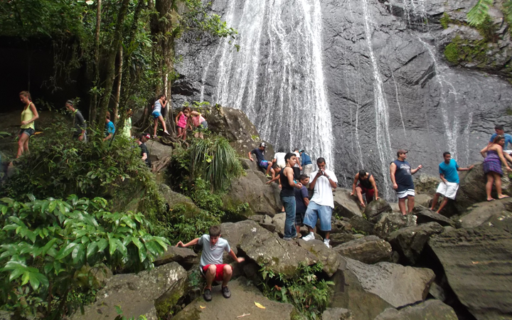 Students exploring El Yunque falls