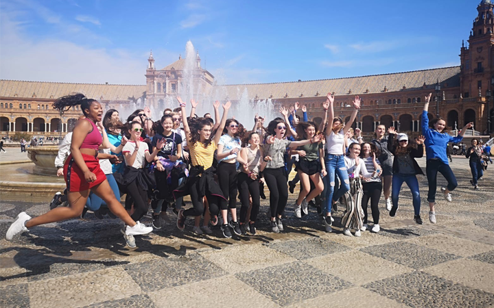 Student group jumping in the the Plaza Mayor