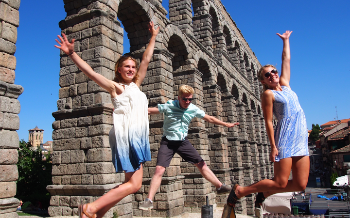 Student jumping at Aqueduct in Segovia