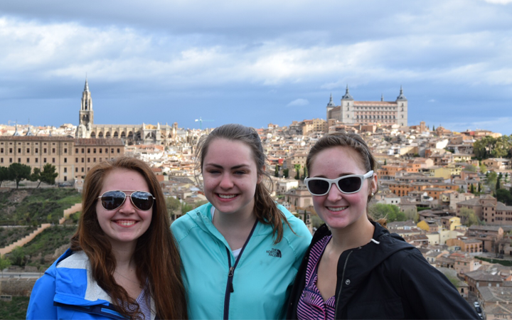 3 girls with Toledo in background