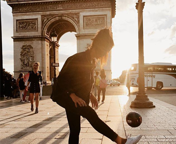 Girl with ball in front of the Arc