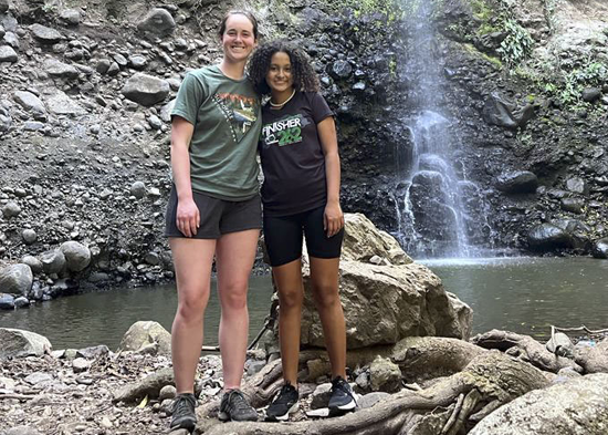 Girls in front of waterfall