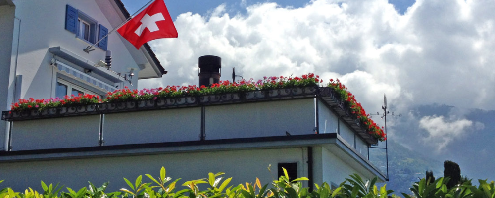 Swiss flag flying over a house