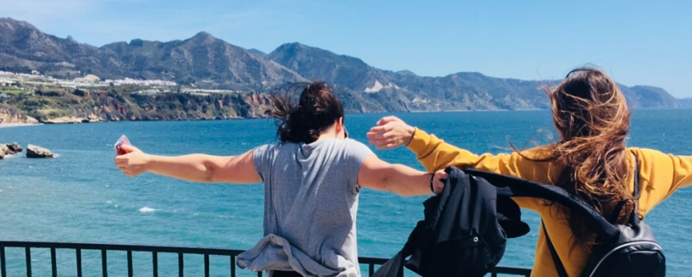 Two girls overlooking the sea