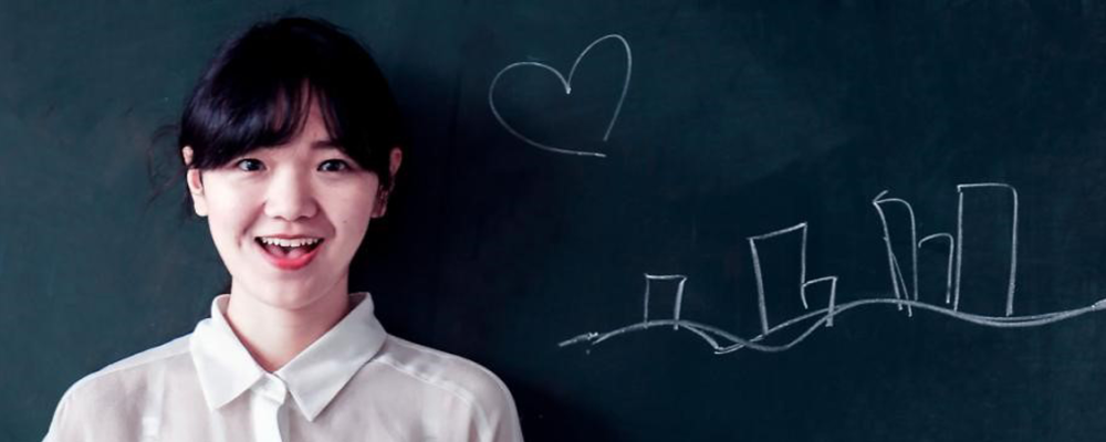 Teacher at Blackboard