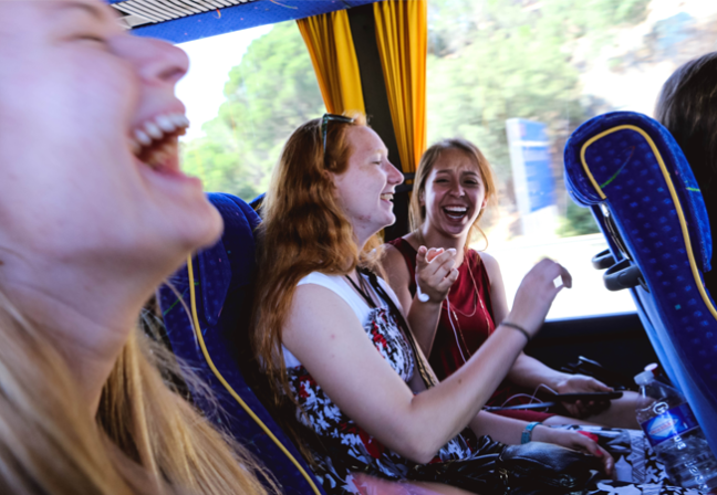 Happy girls on a bus