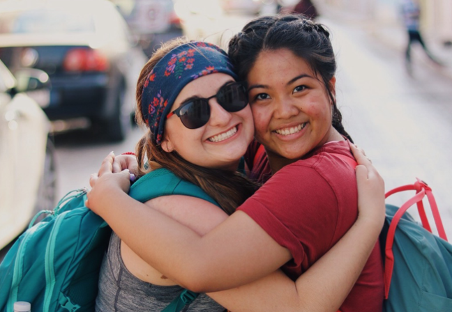 Two girls hugging