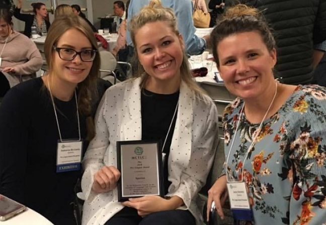 Three women and an award