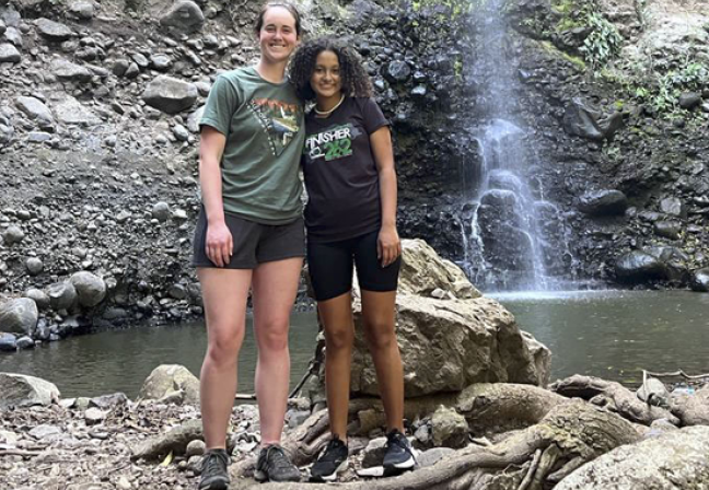 Girls in front of waterfall