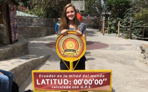 Girl at Equator Sign