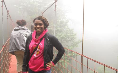 Girl On Rainforest Bridge In Costa Rica