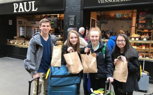 4 People in Front of a Pastry Shop