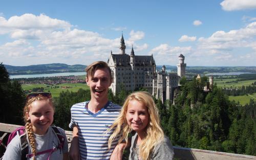 3 Students in Front of Neuschwanstein Castle