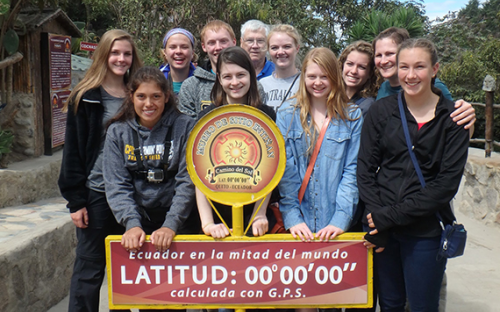 Group at Mitad del Mundo sign