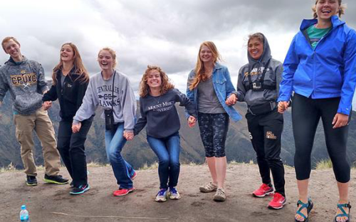 Smiling group on a mountain