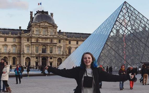 Girl in front of the Louvre