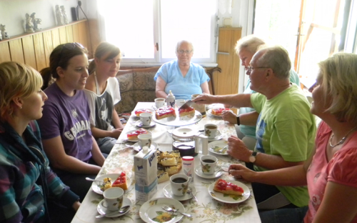 Student eating with host family