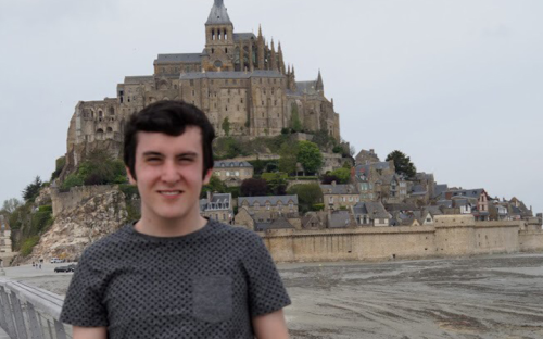 Boy with fortress behind