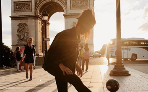 Girl with ball in front of the Arc