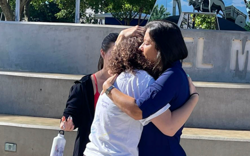 Student hugging host mom