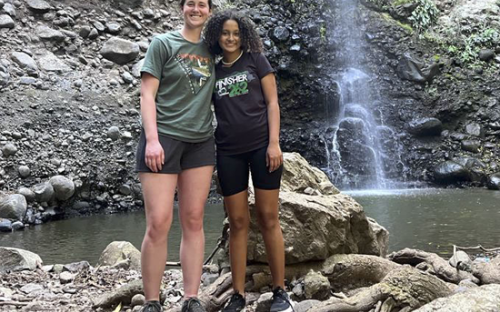 Girls in front of waterfall