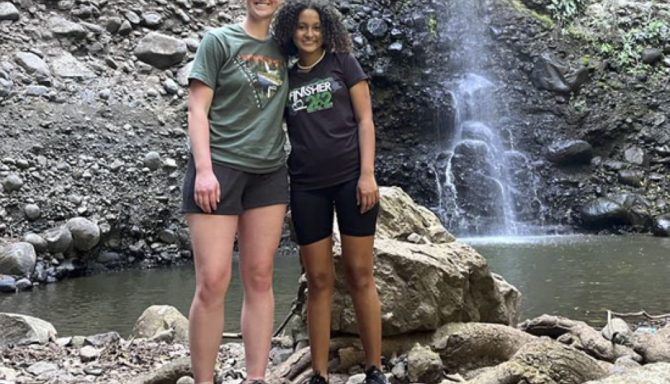 Girls in front of waterfall