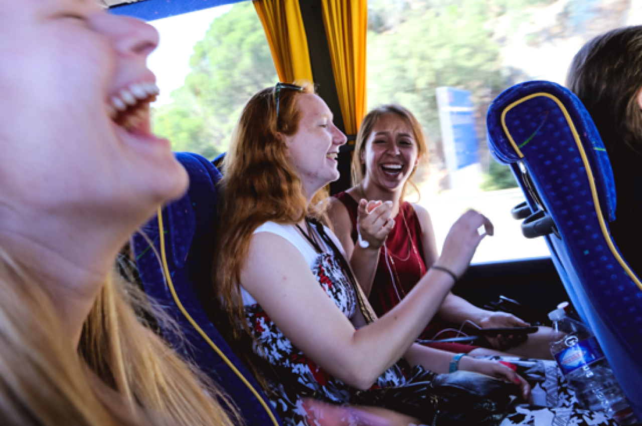 Happy girls on a bus