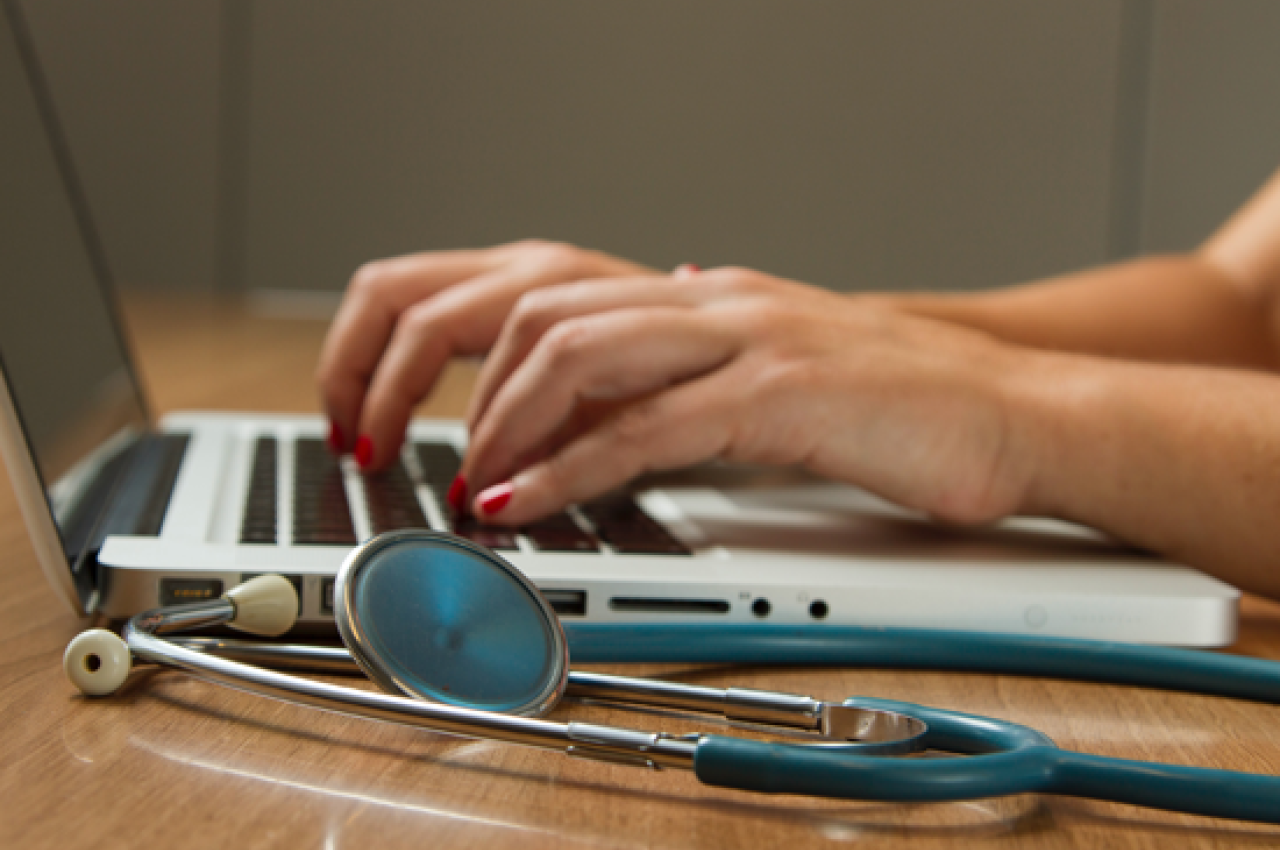 Woman medical professional on a computer