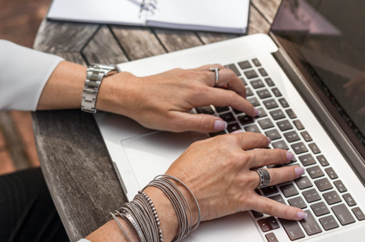 Woman typing on computer