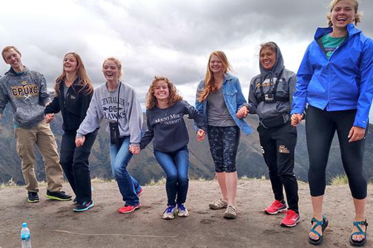 Smiling group on a mountain