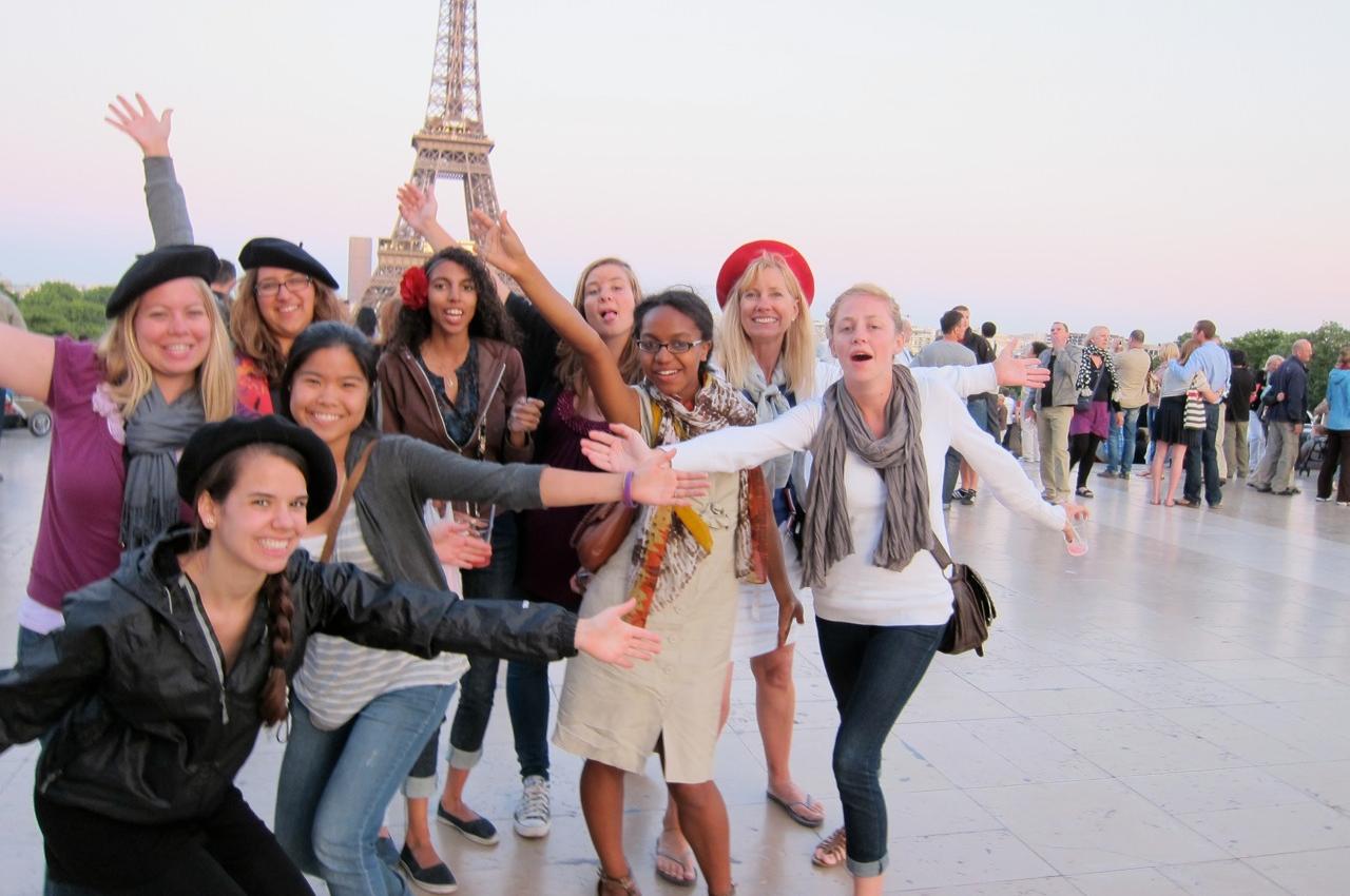 Happy group with Eiffel Tower distant