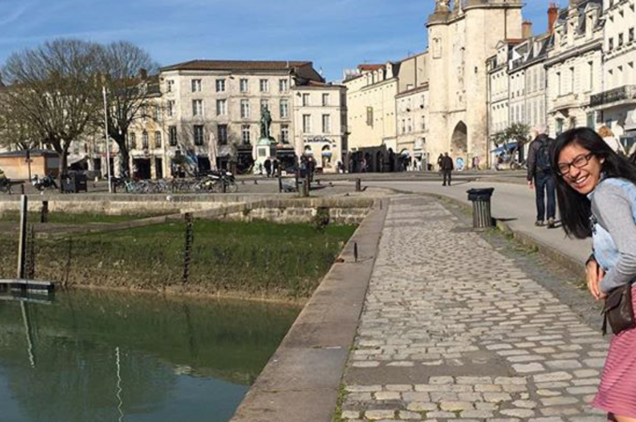 Girl walking along the Seine 