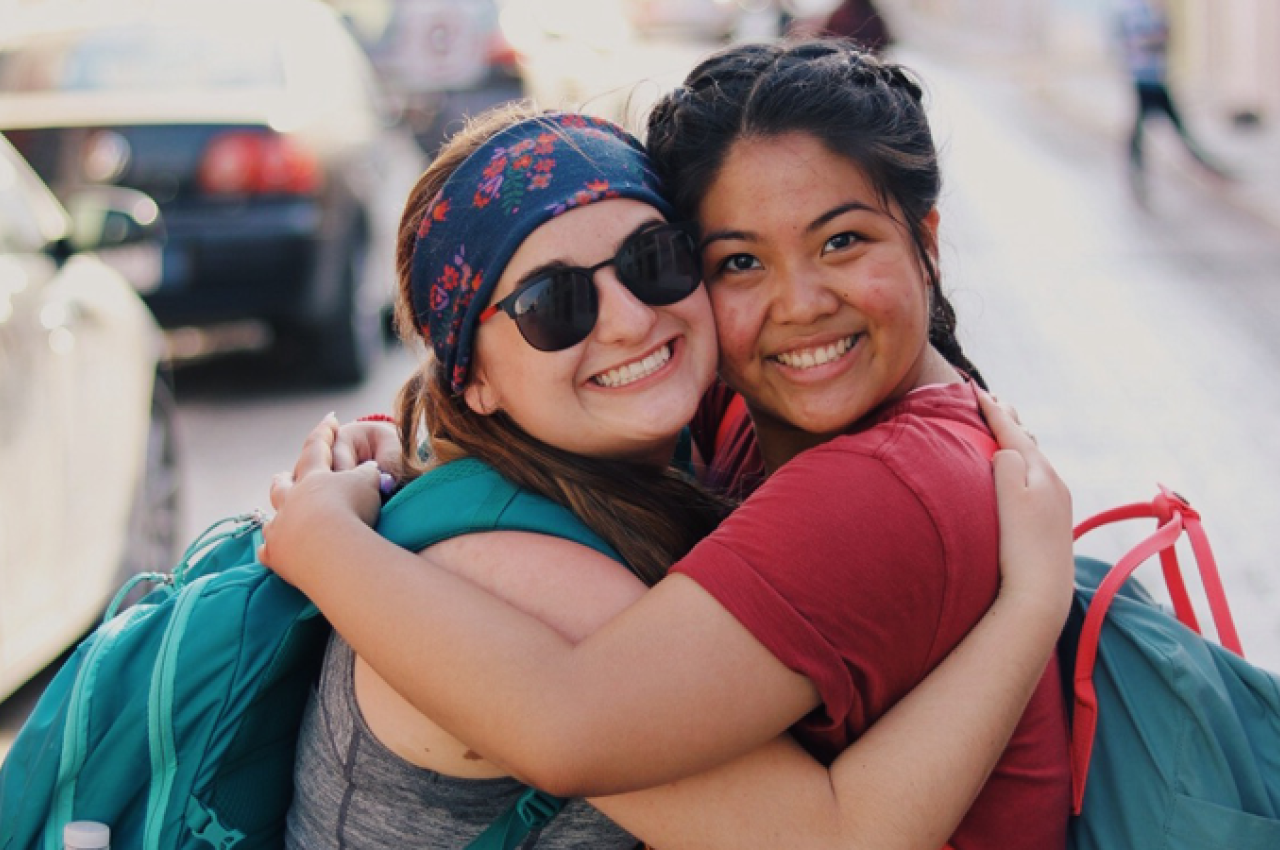 Two girls hugging