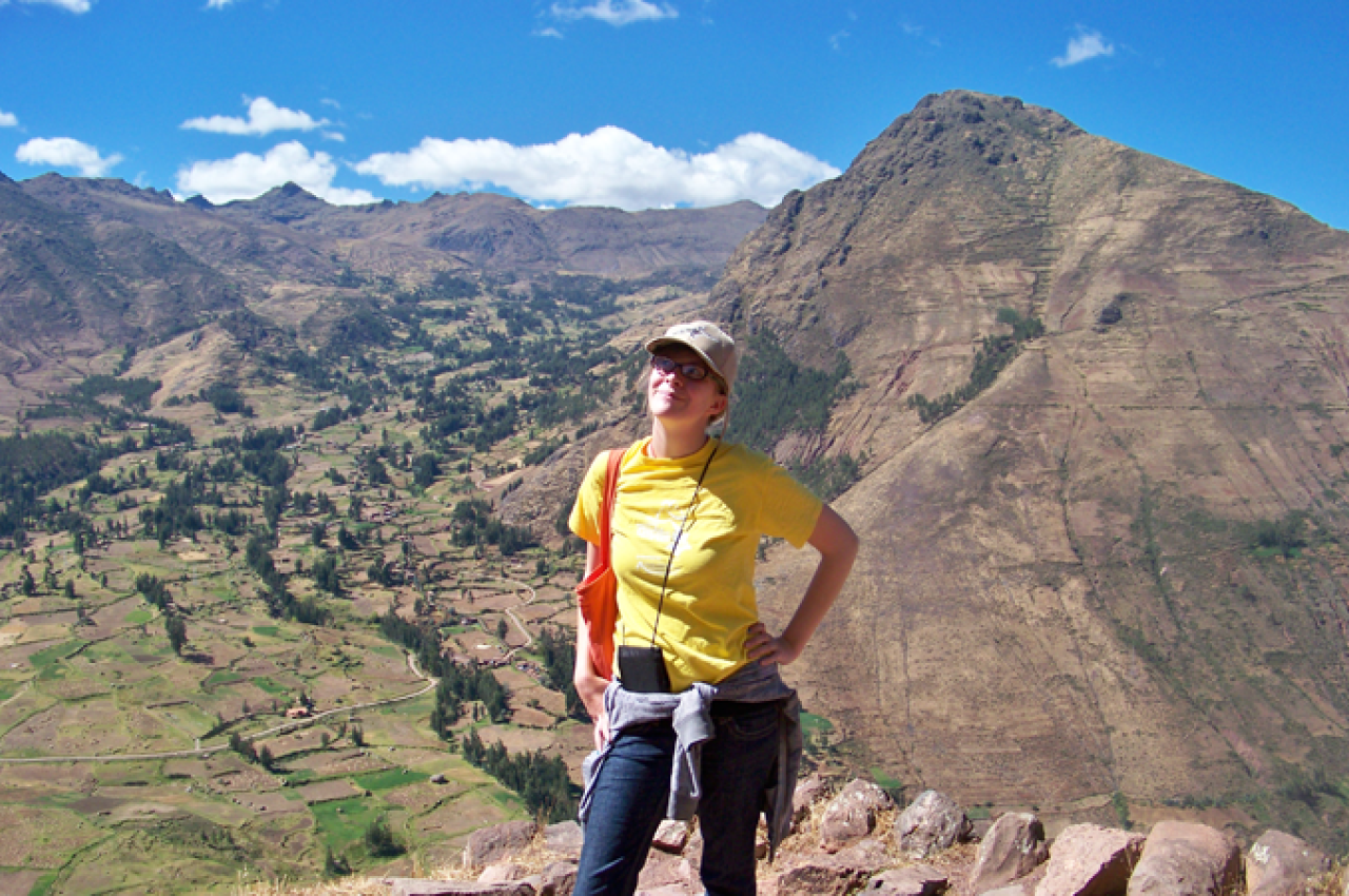 Girl standing on mountaintop