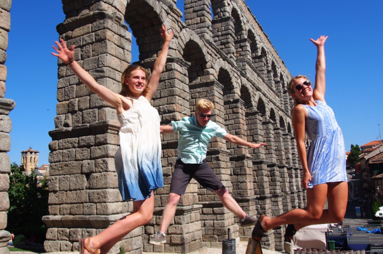 Student jumping at Aqueduct in Segovia