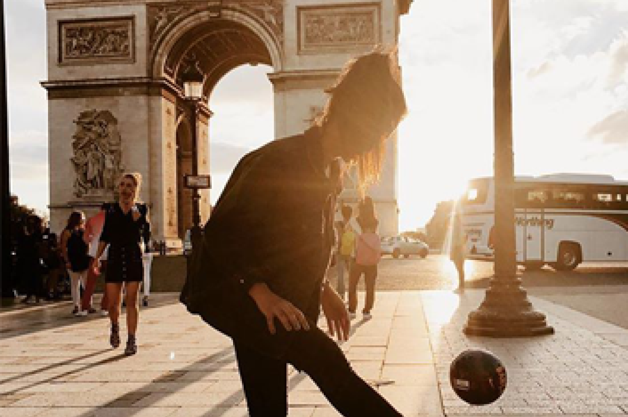 Girl with ball in front of the Arc