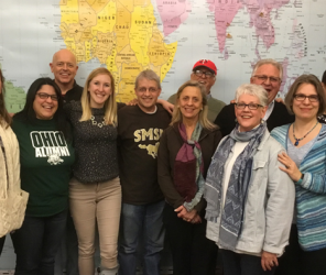 Group of people in front of map