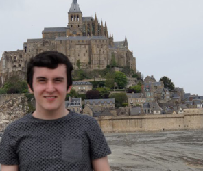 Boy with fortress behind