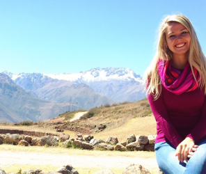 Woman sitting with mountains behind