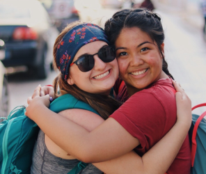 Two girls hugging