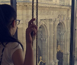 Girl looking out window