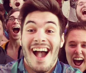 Happy guy taking selfie