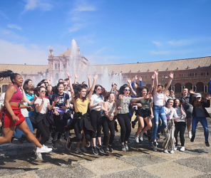 Student group jumping in front of the Plaza Mayor